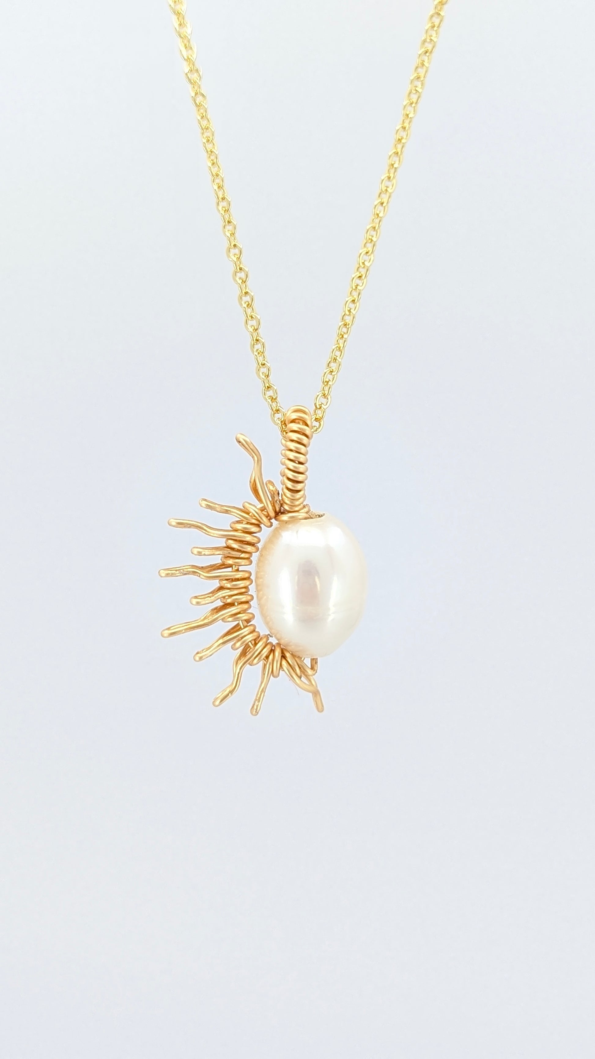 Handcrafted half sun pendant necklace with freshwater pearl on a gold-tone adjustable chain