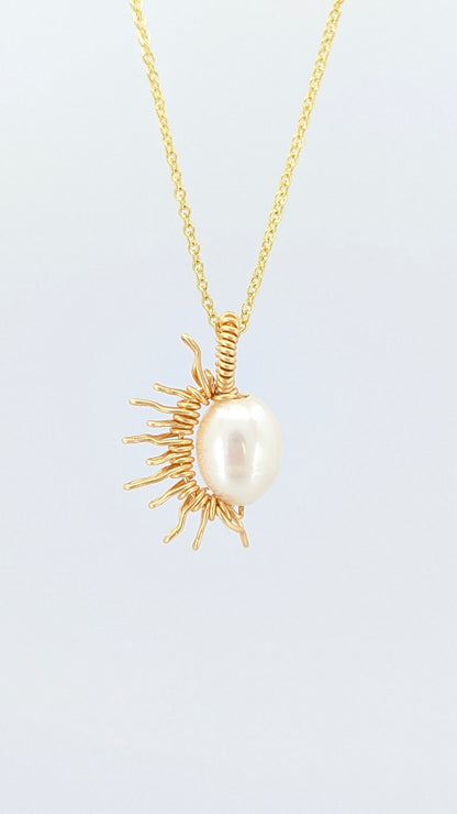 Handcrafted half sun pendant necklace with freshwater pearl on a gold-tone adjustable chain