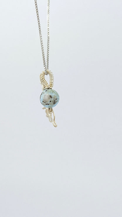 Handcrafted half sun pendant necklace with Larimar stone on a silver-tone adjustable chain.