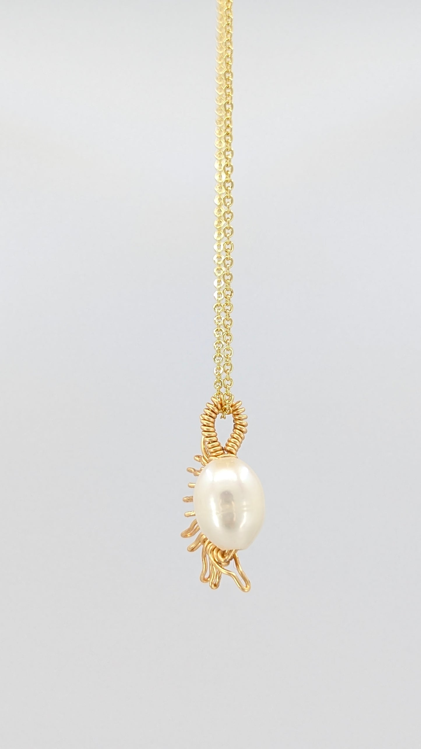 Handcrafted half sun pendant necklace with freshwater pearl on a gold-tone adjustable chain