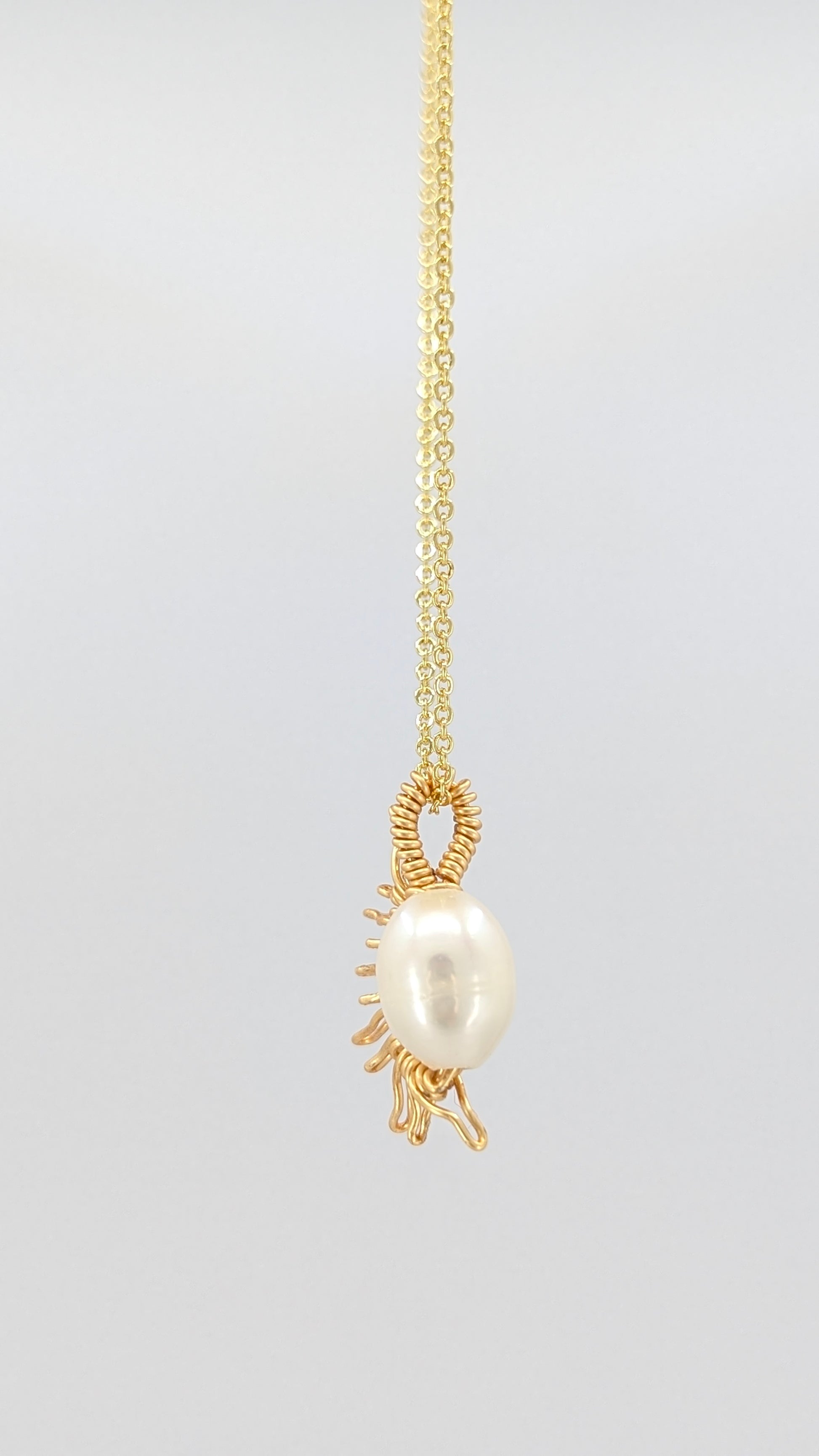 Handcrafted half sun pendant necklace with freshwater pearl on a gold-tone adjustable chain