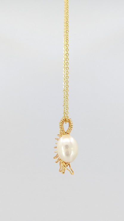 Handcrafted half sun pendant necklace with freshwater pearl on a gold-tone adjustable chain